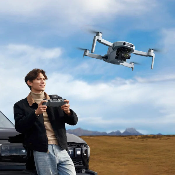 Potensic ATOM 2 4K Drone Bundle with 128GB MicroSD Card, Remote Lanyard and 2 Spare Propeller Kits.