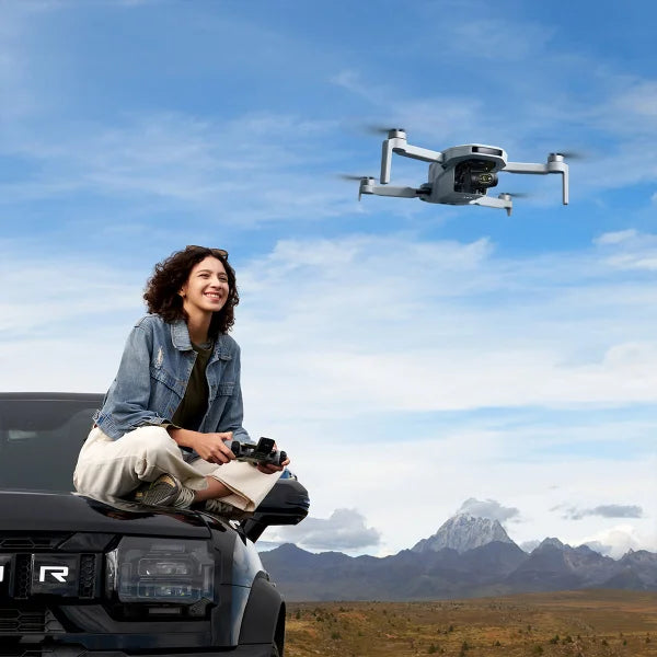 Potensic ATOM 2 4K Drone Bundle with 128GB MicroSD Card, Remote Lanyard and 2 Spare Propeller Kits.